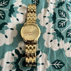 Nine West big face women’s watch. Yellow gold, thick chain band.